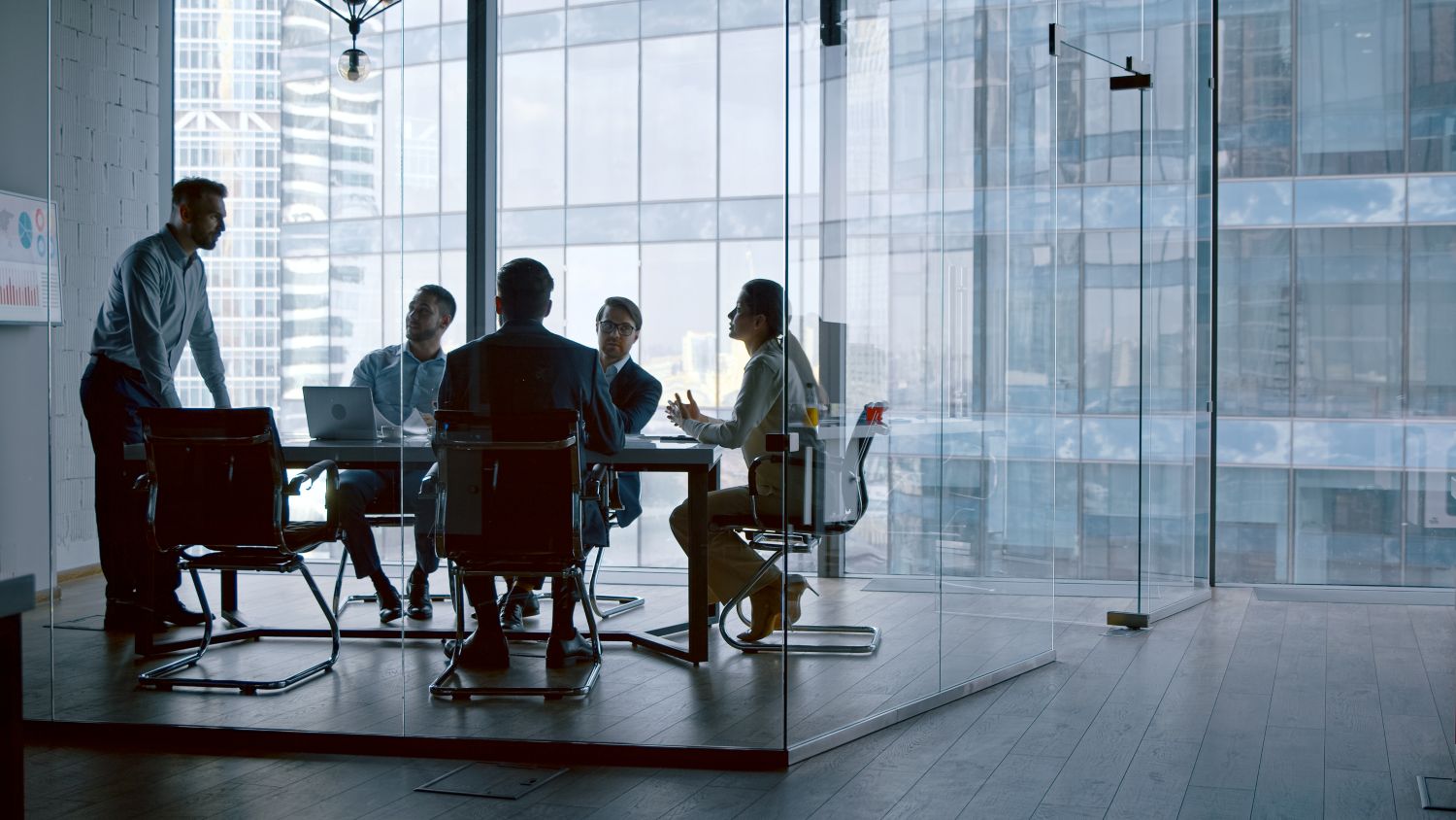 Photo of a corporate meeting dealing with a crisis. Dr. Ginny Estupinian provides crisis management consultation to help organizations navigate the stress and make the best decisions.